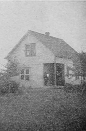 Beginning a home in the prairie—house and table "lands" are built on cement foundation.